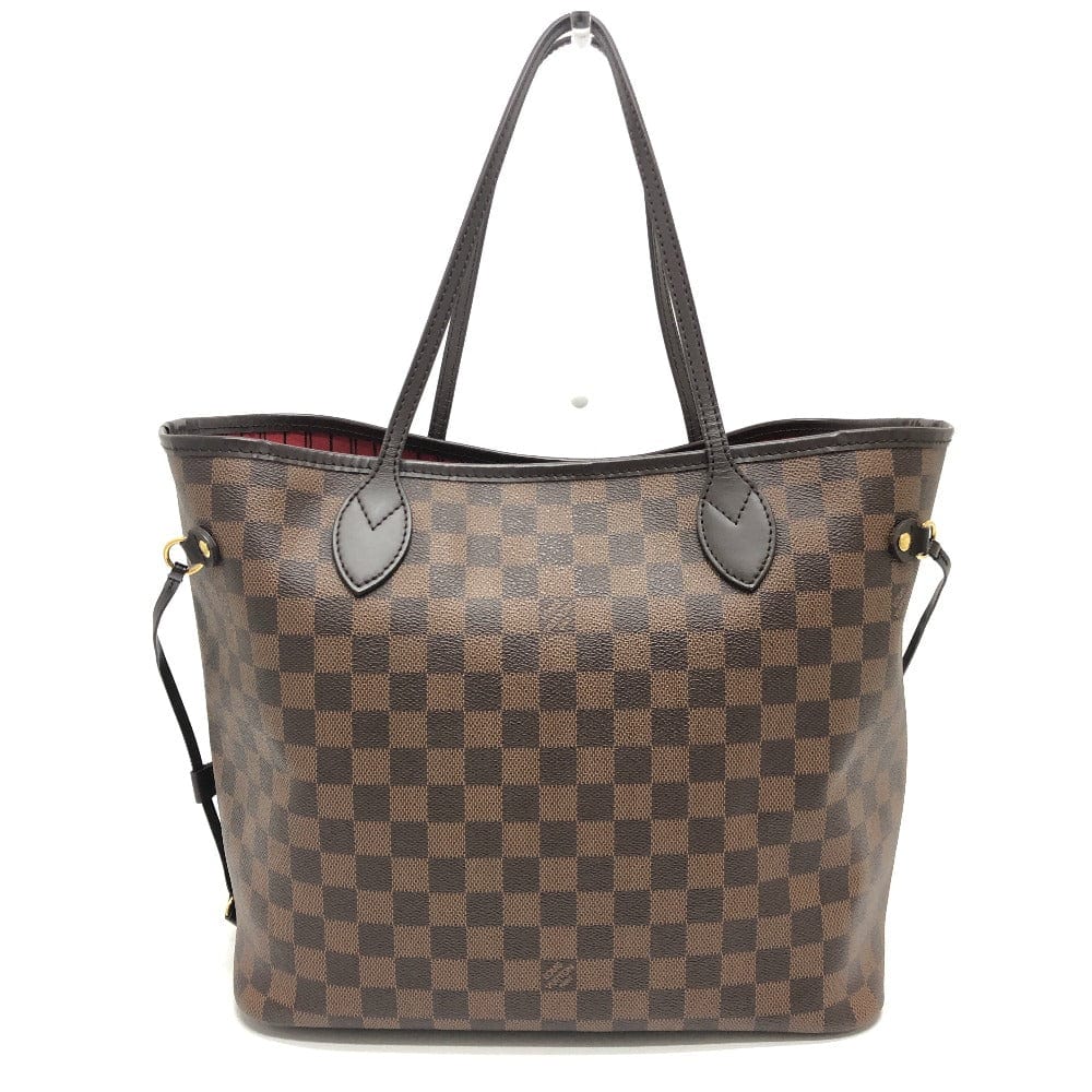 Brown checkered handbag with black handles on a white background