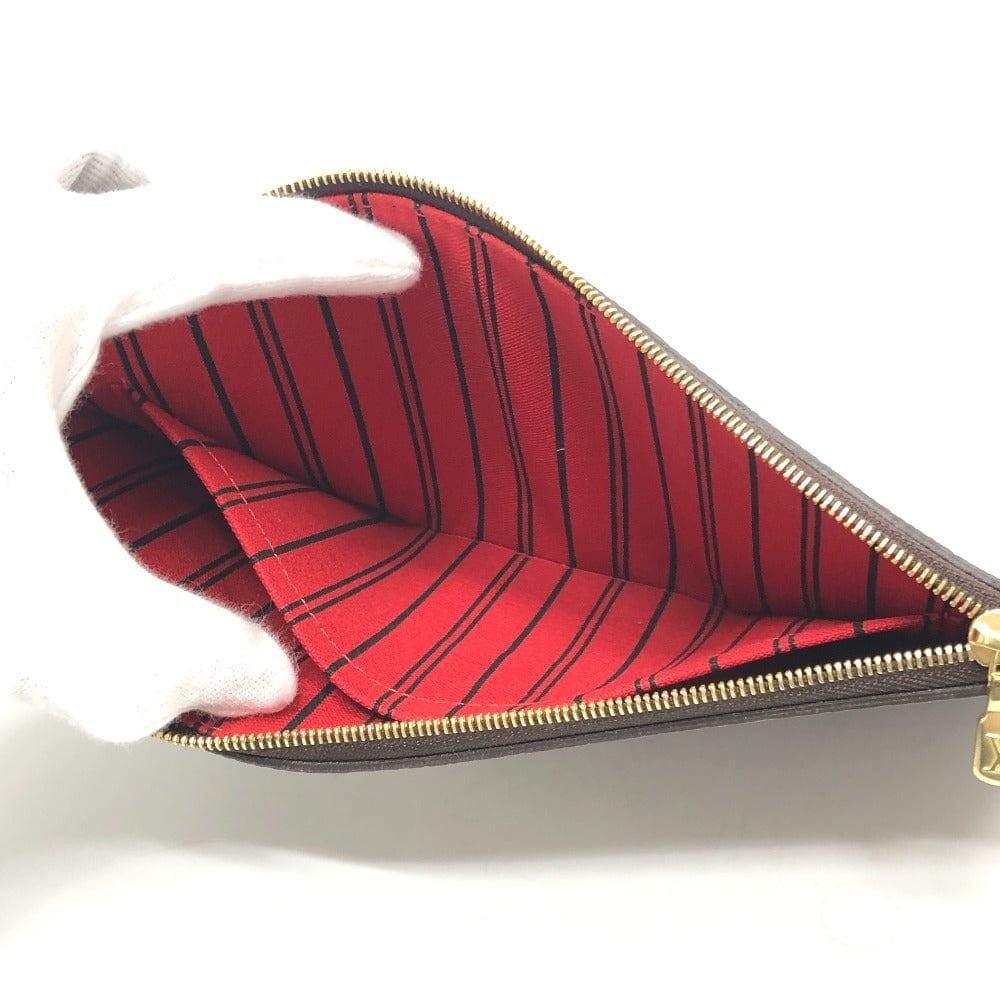 Open pouch with red striped interior on a white background