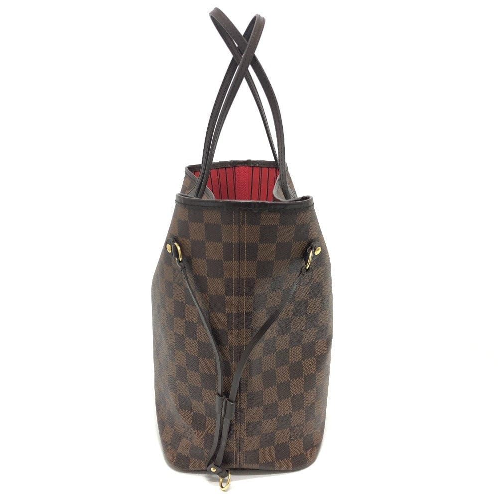 Brown checkered handbag with black handles on a white background