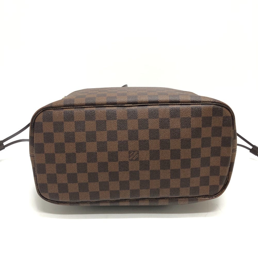 Brown checkered handbag on a white background