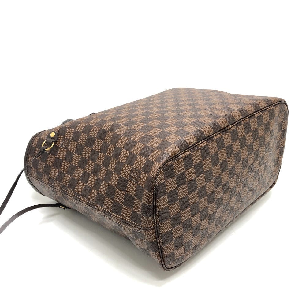 Brown checkered handbag on a white background