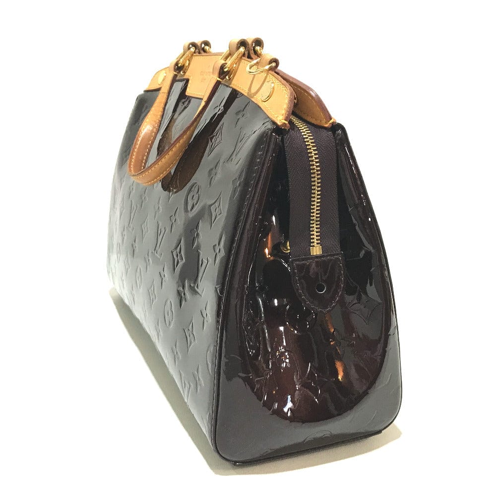 Pretend luxury handbag with gold accents on a white background