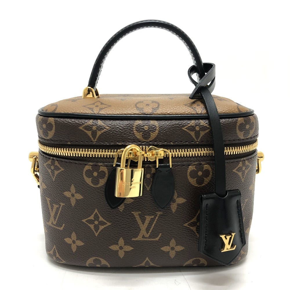 Louis Vuitton monogram handbag with black handle and gold zipper on a white background
