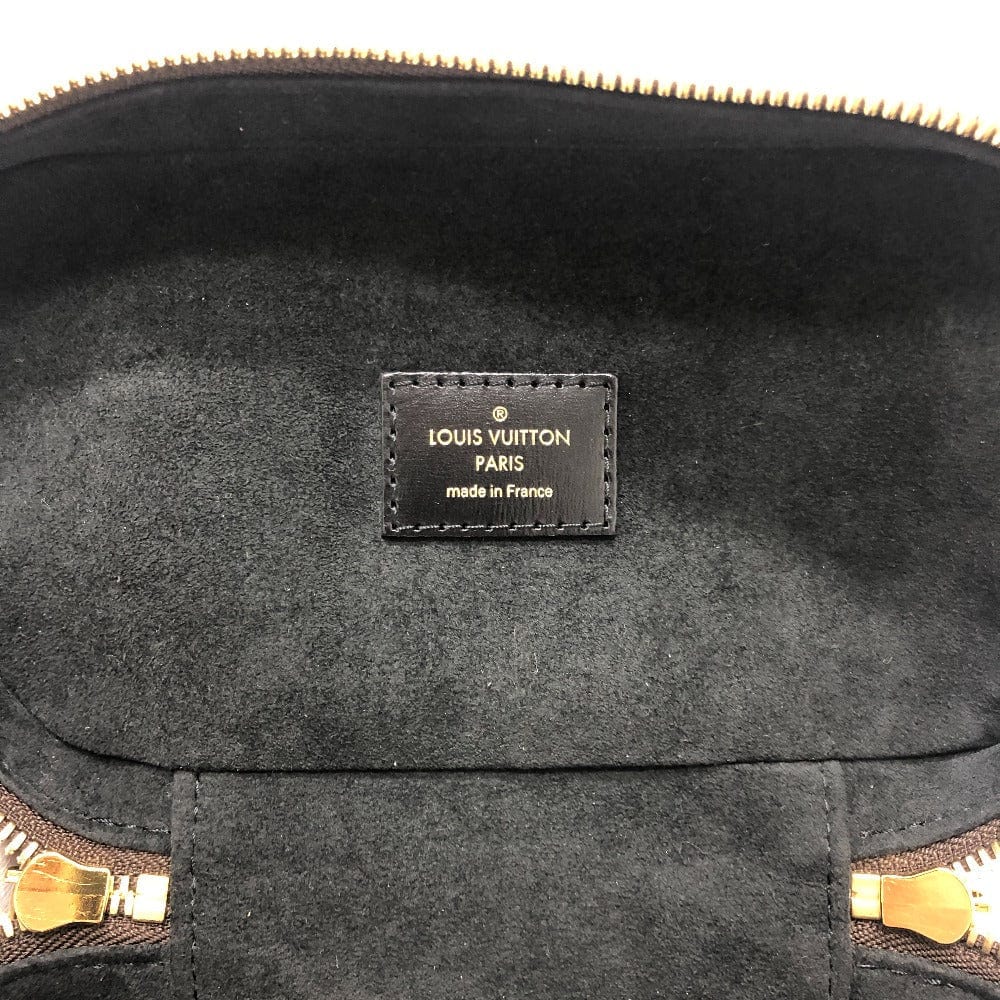 Louis Vuitton bag with a visible brand label on a dark background