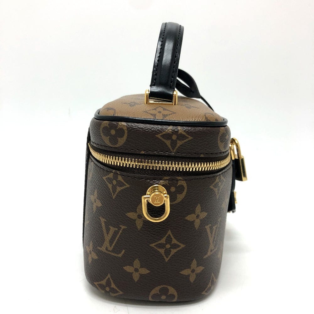 Louis Vuitton monogram handbag with gold accents on a white background