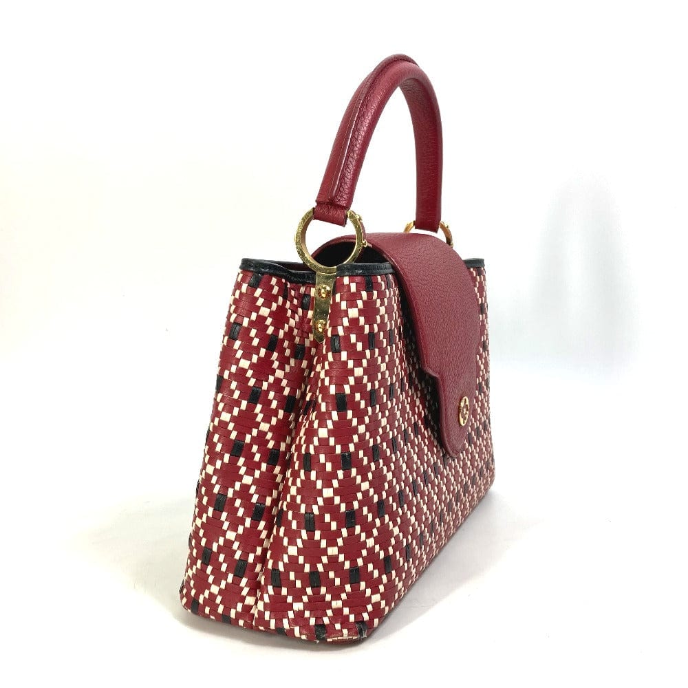 Handbag with red and white pattern on a white background