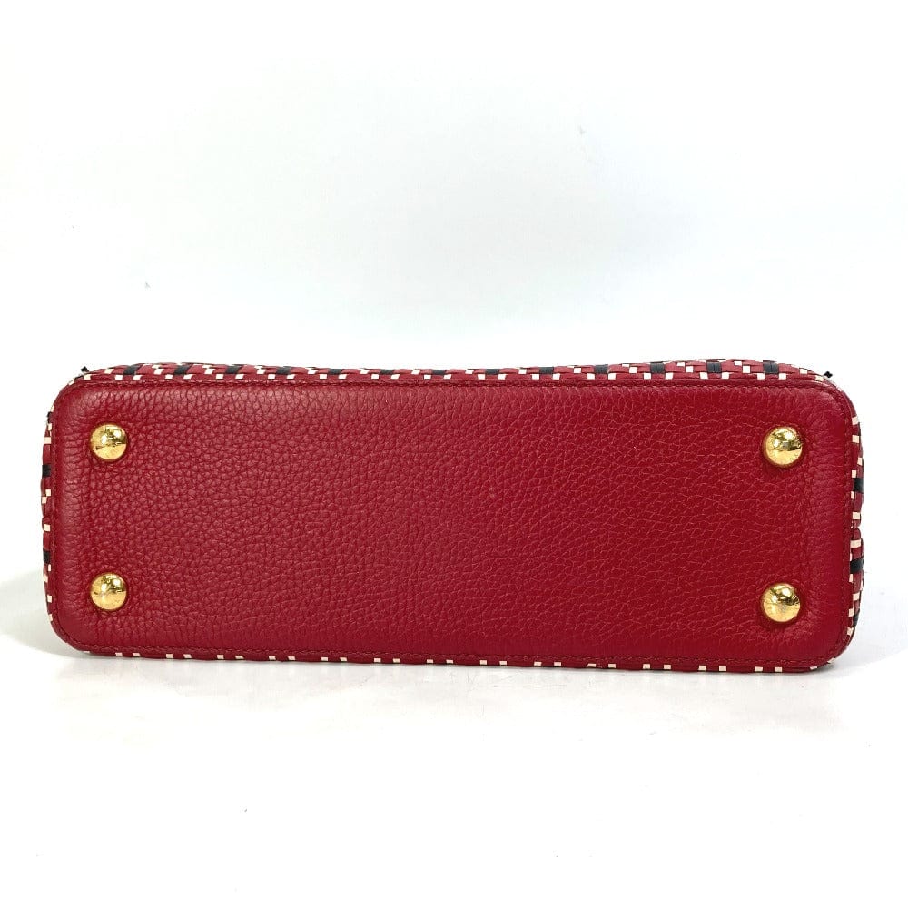 Red wallet with gold studs on a white background