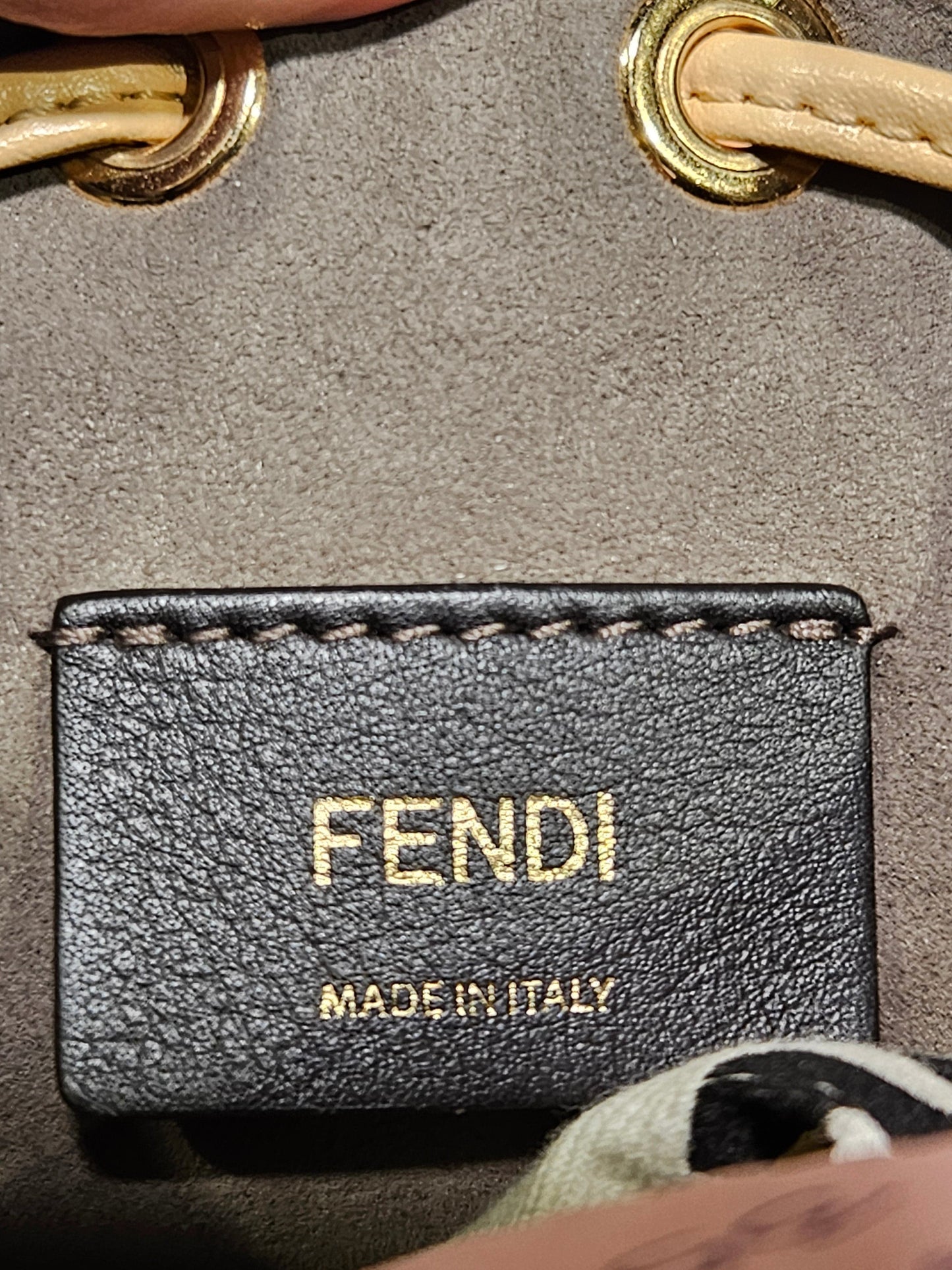Fendi logo on a leather tag of a handbag