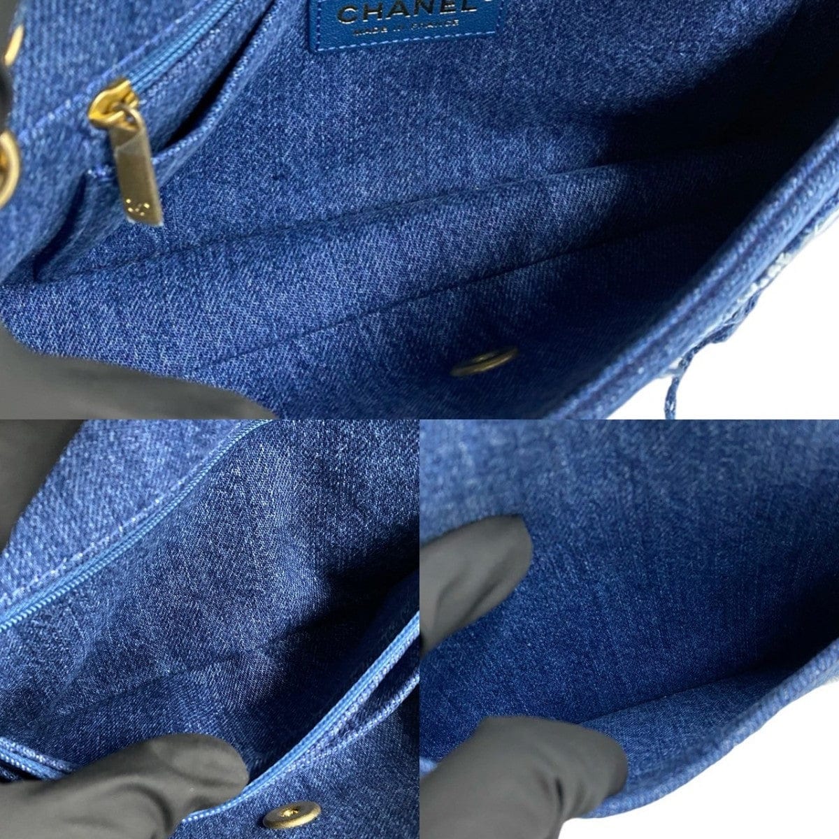 Close-up of a blue Chanel handbag with gold hardware on a white background