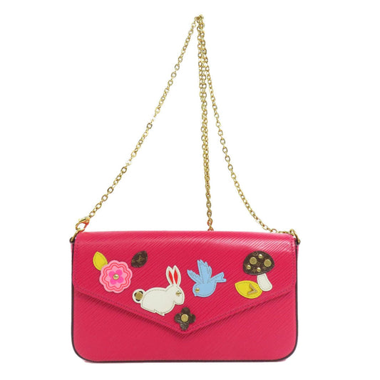 Pink handbag with decorative elements on a white background