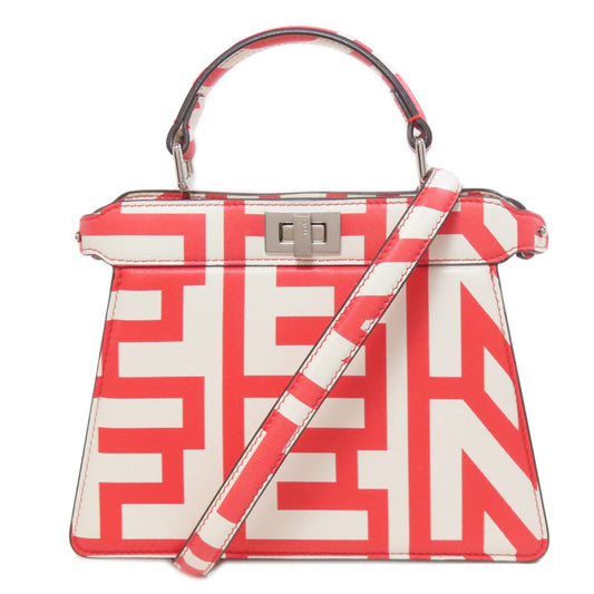 Handbag with red and white geometric pattern on a white background