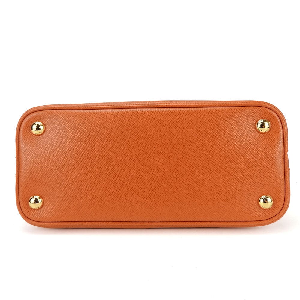 Orange handbag with gold accents on a white background