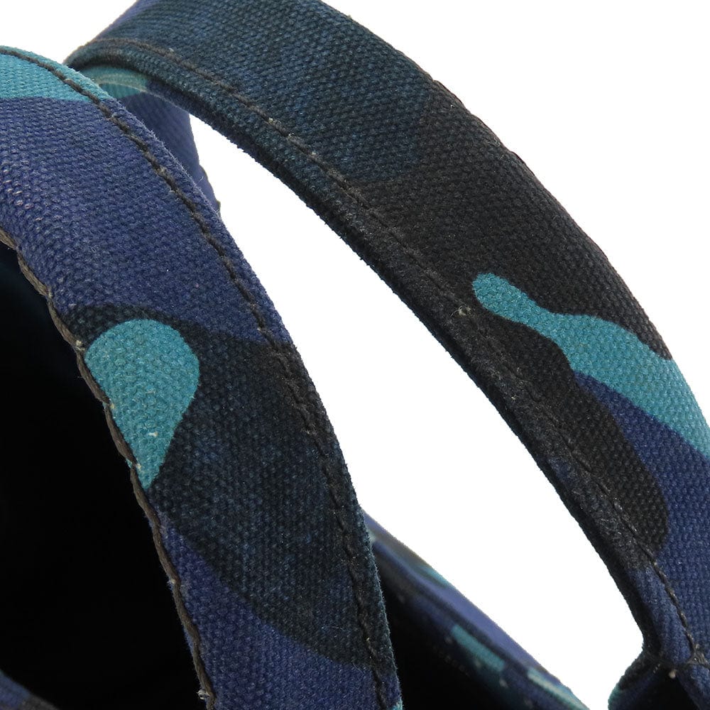 Close-up of a blue and black camouflage-patterned strap on a white background