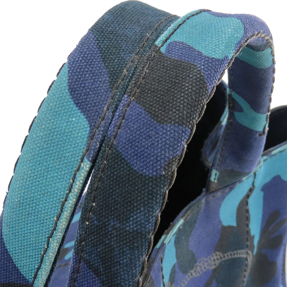 Close-up of a blue camouflage-patterned shoe with a white background