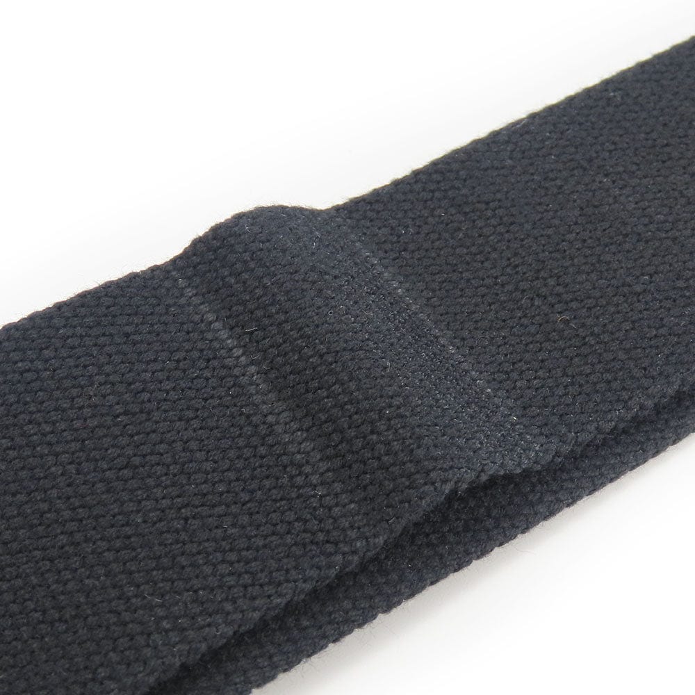 Close-up of a dark gray woven belt on a white background