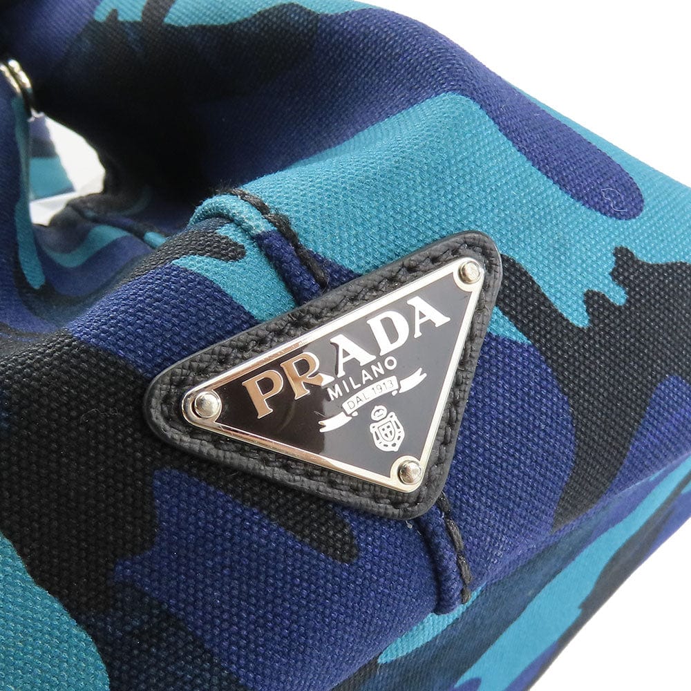 Blue camouflage sneaker with Prada logo on a white background
