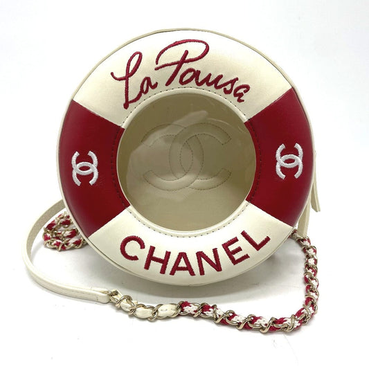 Chanel handbag designed like a life buoy with 'La Pausa' text on a white background