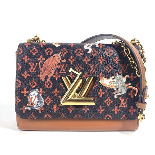 Designer handbag with patterned design and gold accents on a white background