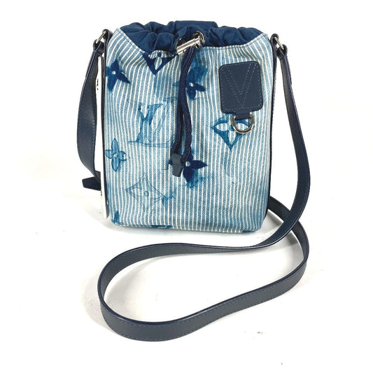 Blue butterfly-patterned bag with a strap on a white background