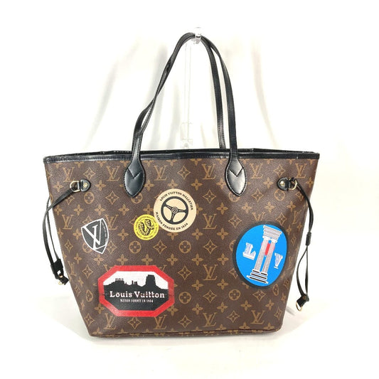 Designer handbag with multiple stickers on a white background