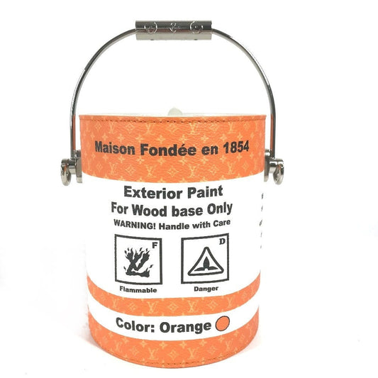 Paint bucket with orange label and warning signs on a white background