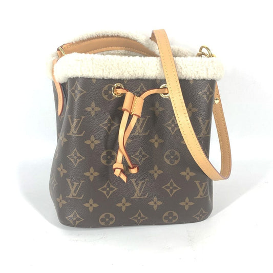 Designer handbag with monogram pattern on a white background