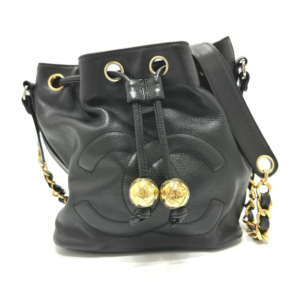 Black leather bucket bag with gold hardware on a white background