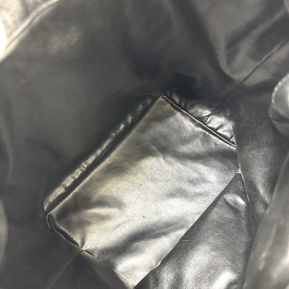 Close-up of a black leather jacket with visible stitching