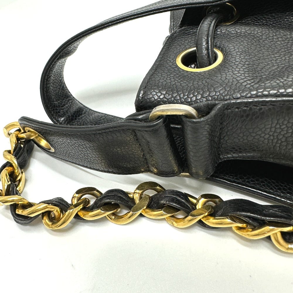 Black leather handbag with gold chain strap on a white background