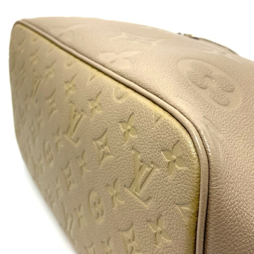Beige leather handbag with brand logo embossed on a white background