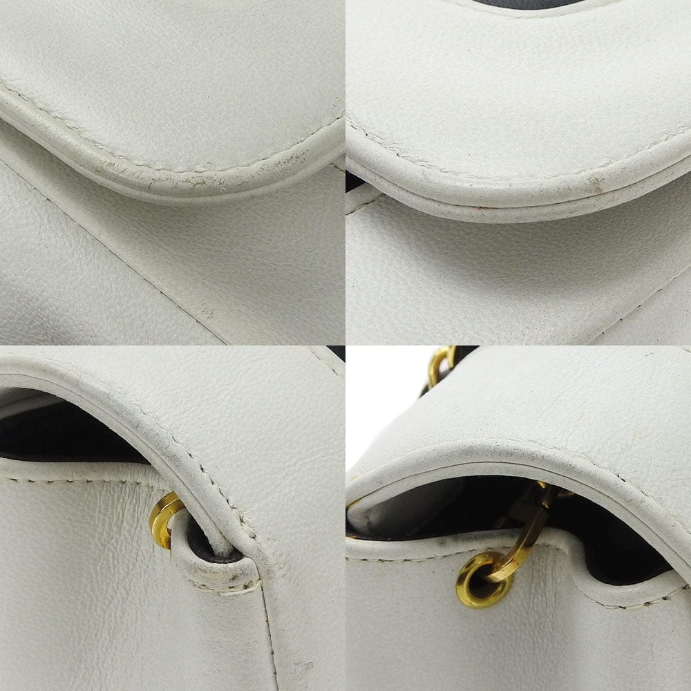 Close-up of a white leather bag with gold hardware in four different angles.