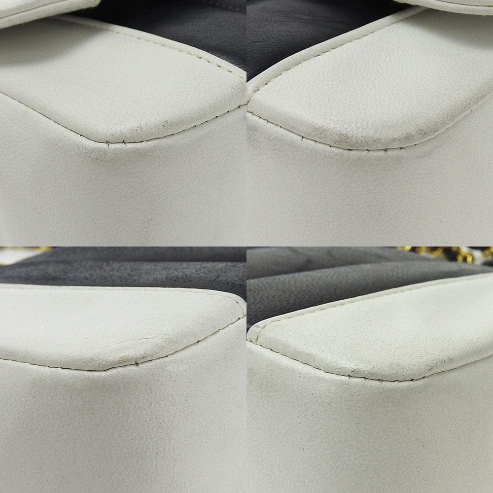 Close-up of a car seat with quilted pattern and stitching detail.