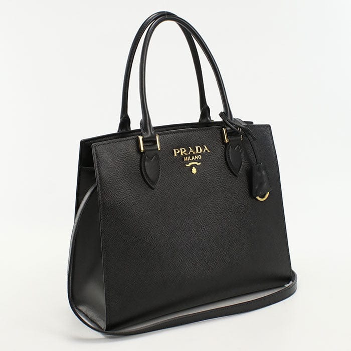 Black Prada handbag on a white background