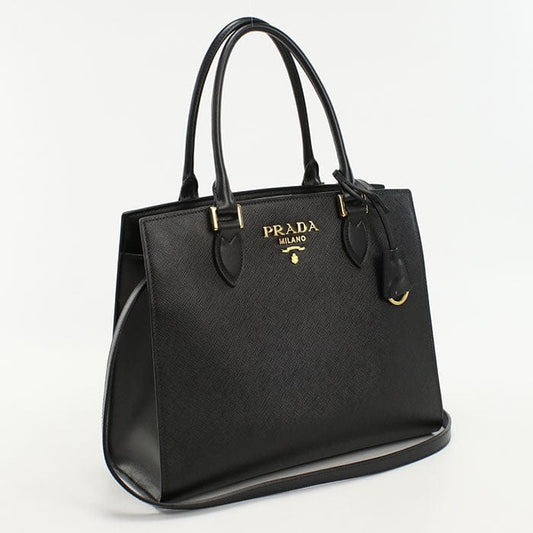 Black Prada handbag on a white background