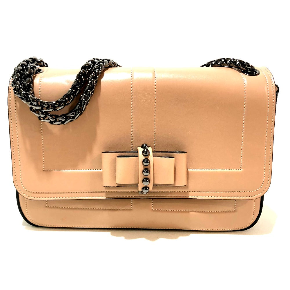 Beige handbag with a bow and chain detail on a white background