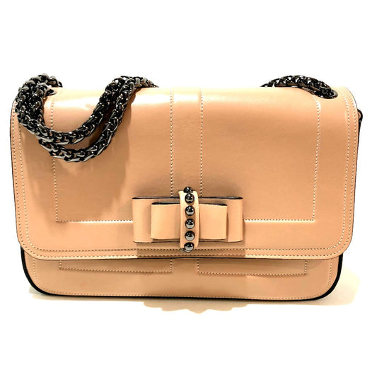 Beige handbag with a bow and chain detail on a white background