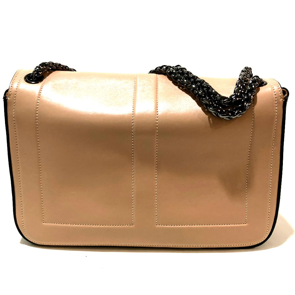 Beige handbag with black chain handle on a white background