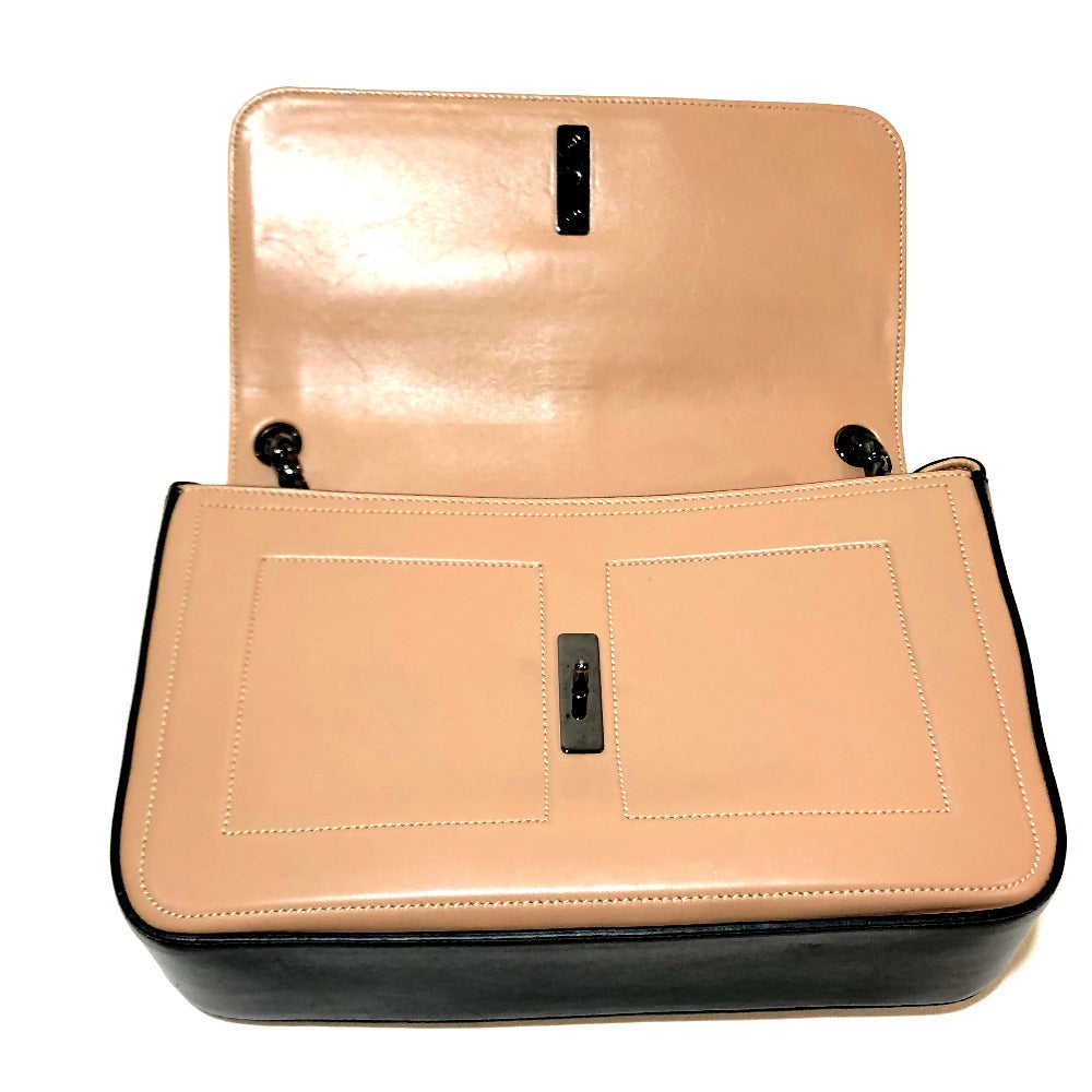 Beige handbag with black accents on a white background