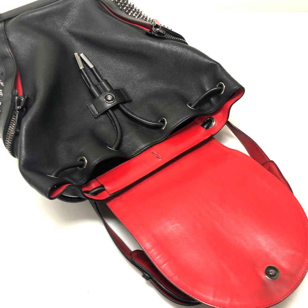 Black and red leather bag with a strap on a white background
