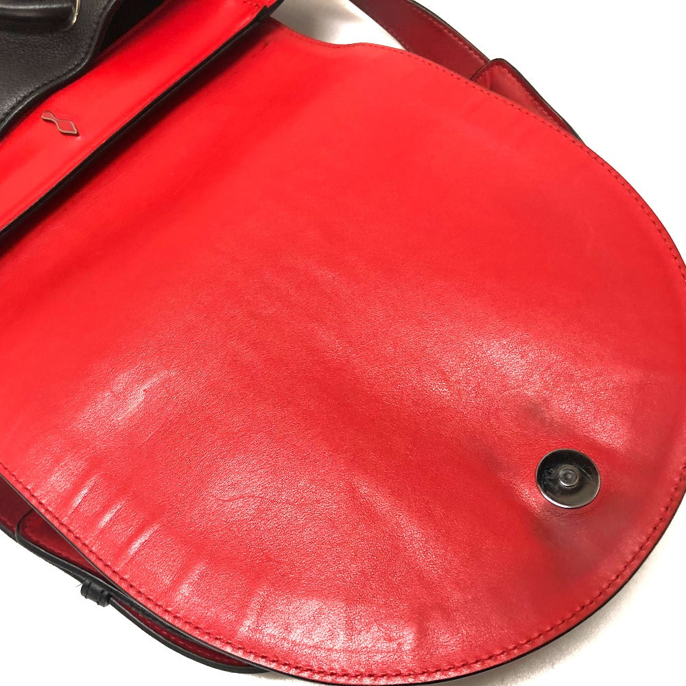 Close-up of a red leather bag with a metal clasp on a white background