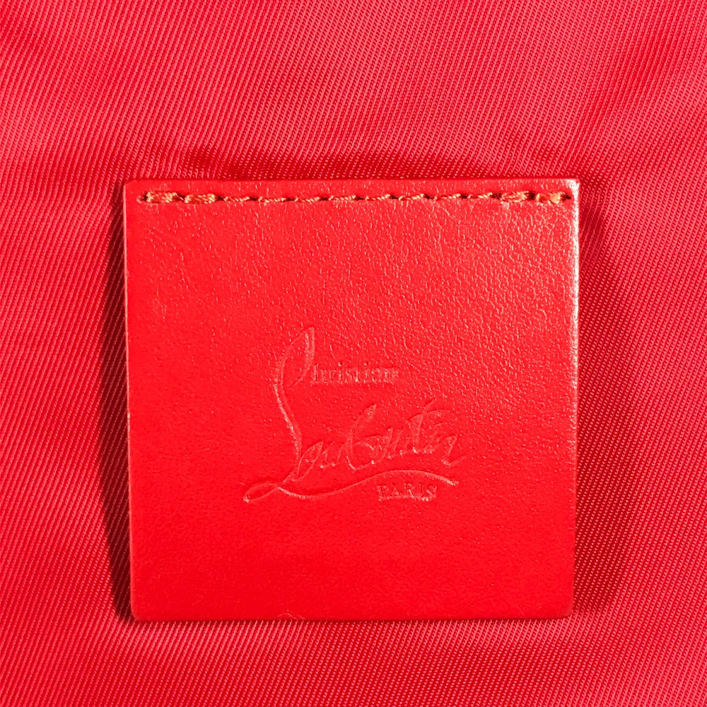 Red leather patch with a brand logo on a red background
