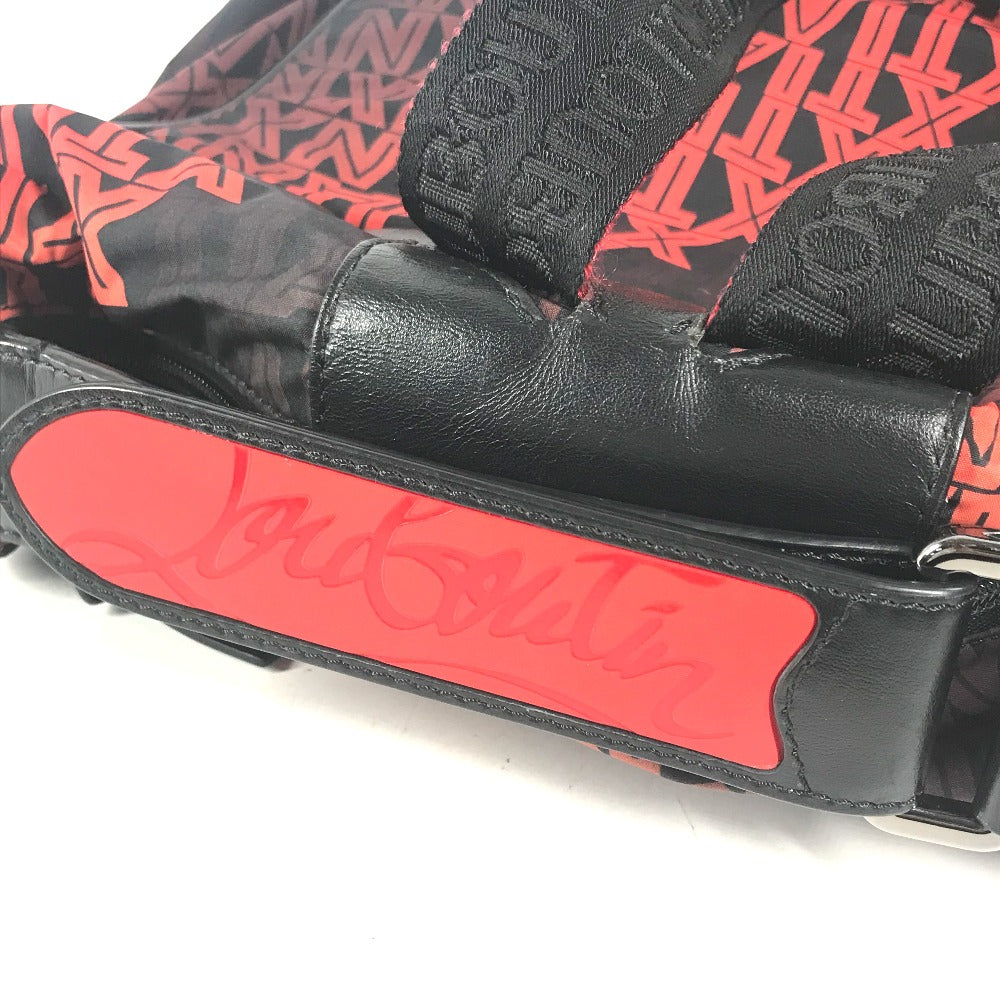 Black and red glove with visible branding on a white background