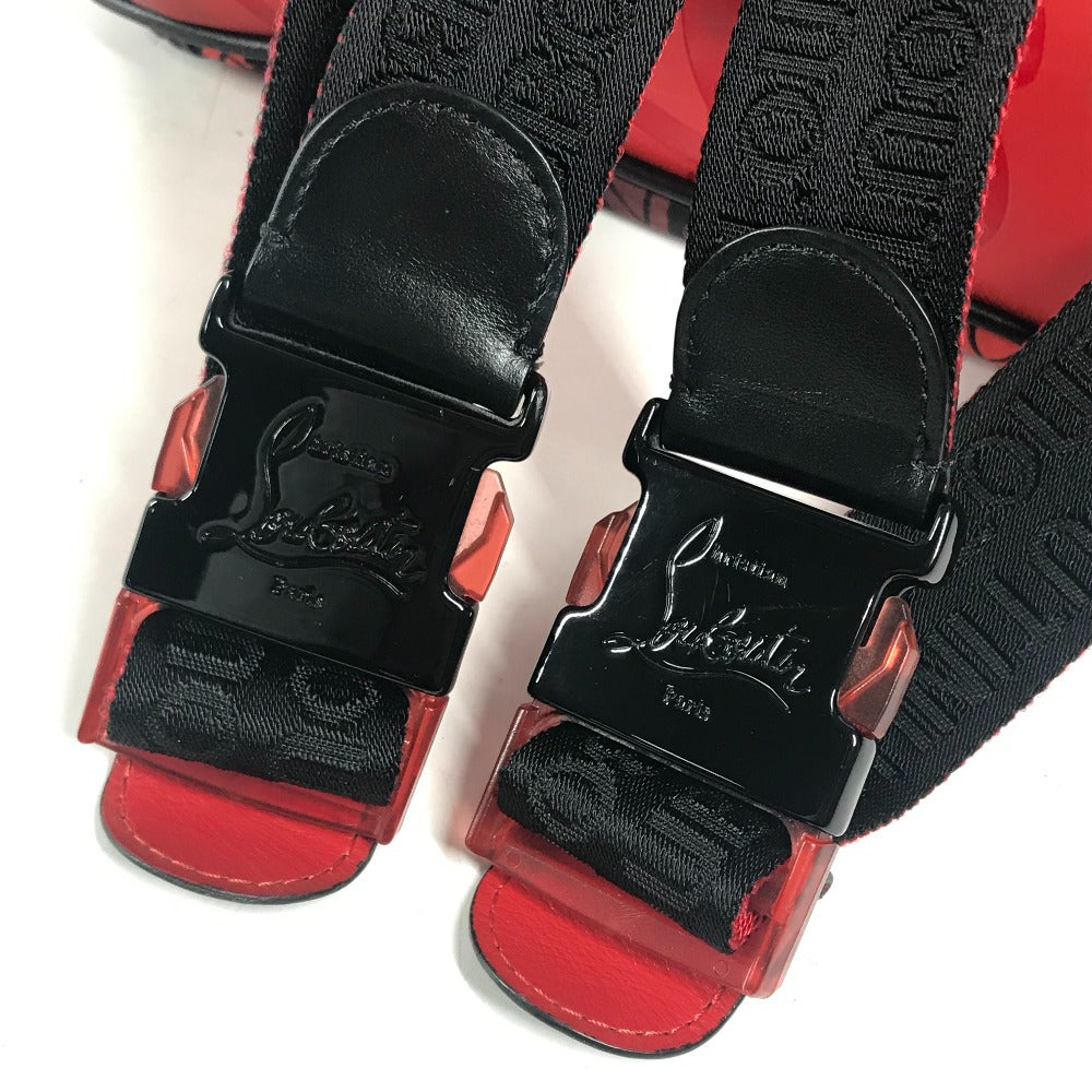 Red sandals with black straps featuring a logo on a white background