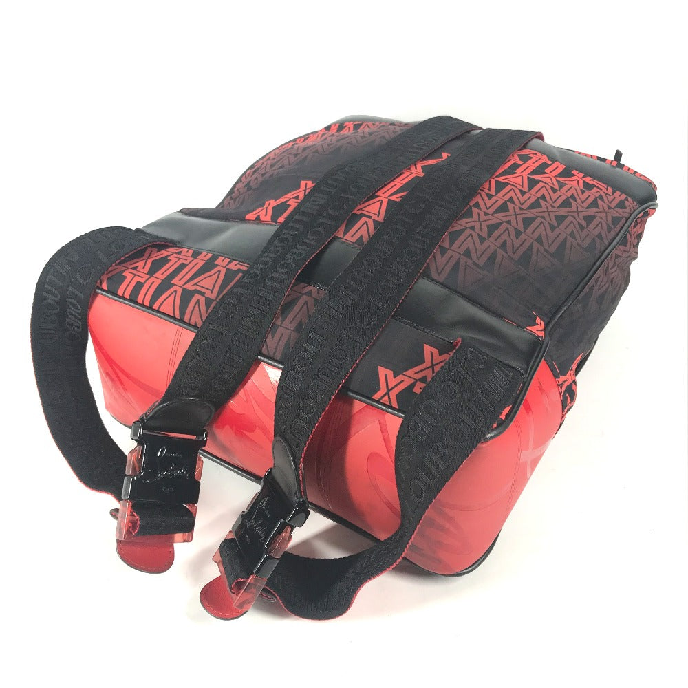 Red and black backpack with geometric patterns on a white background
