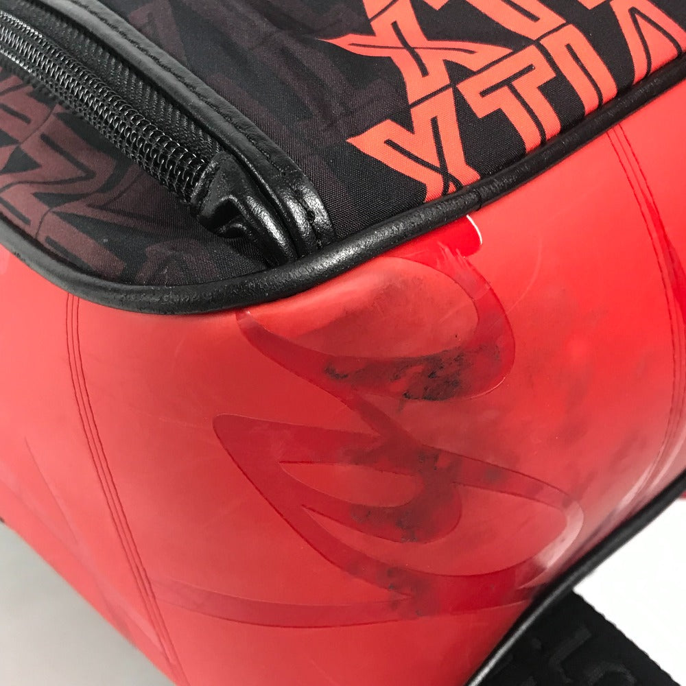 Close-up of a red and black bag with a reflective surface