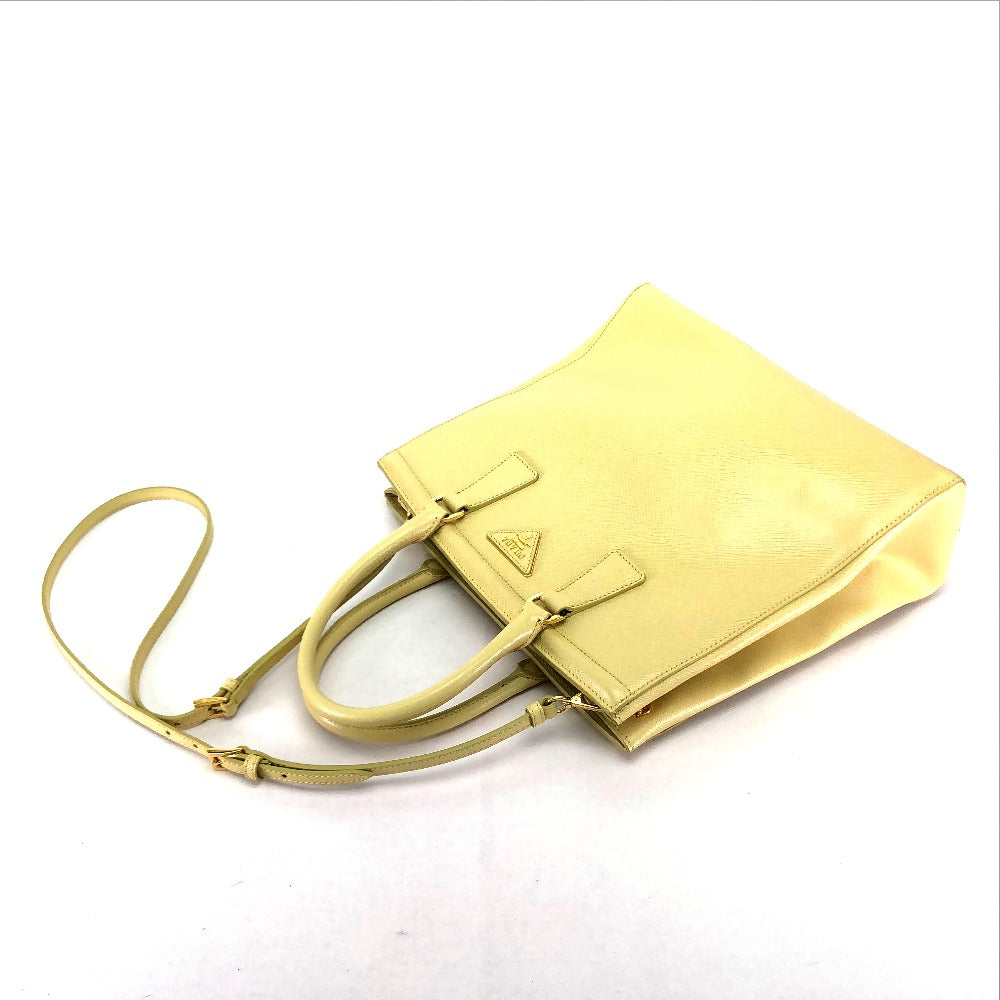 Yellow handbag with a strap on a white background