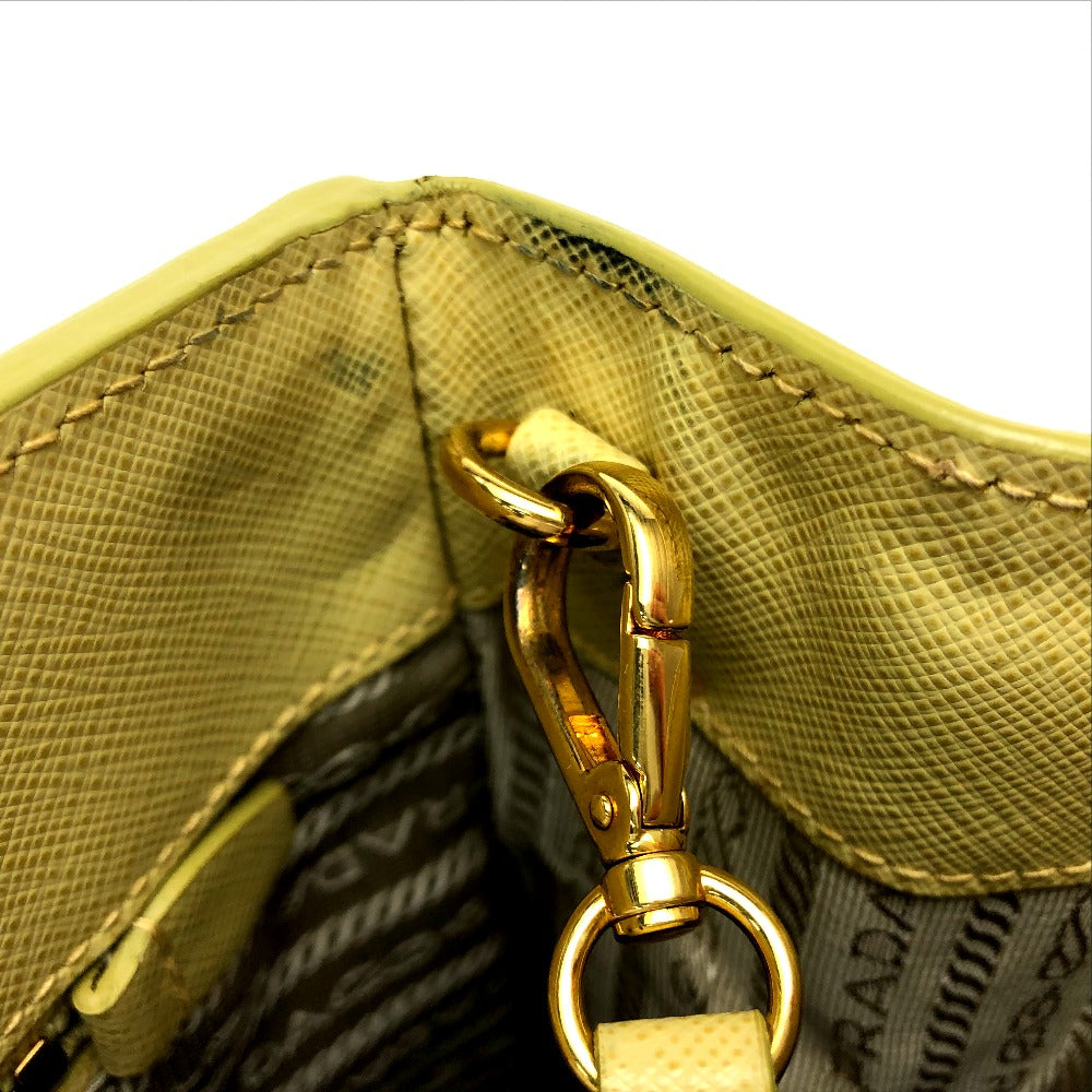 Close-up of a gold clasp on a textured surface