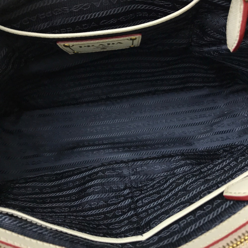 Close-up of a Prada handbag with visible branding.