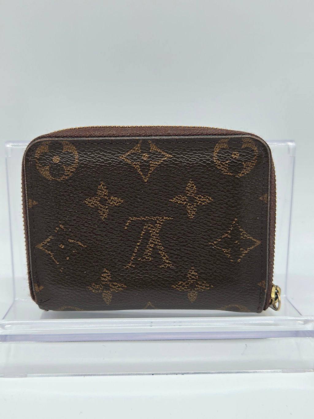Brown wallet with pattern on a white background
