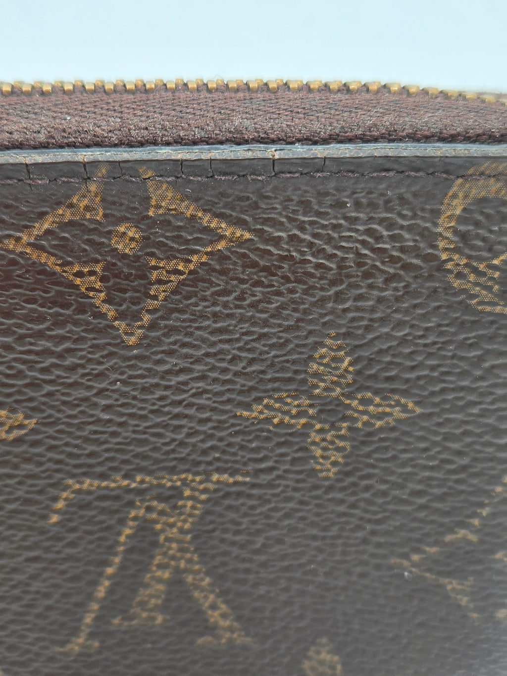 Close-up of a textured surface with a pattern, likely a fabric or leather texture.